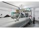 Organized garage interior with a classic car, overhead storage, and ample space at 10381 Borah Park Cir, Las Vegas, NV 89178