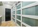 Hallway featuring unique sliding closet doors and stylish floor tiles at 10381 Borah Park Cir, Las Vegas, NV 89178