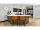 Modern kitchen featuring dark cabinets, quartz countertops, a stylish island and stainless steel appliances at 10381 Borah Park Cir, Las Vegas, NV 89178