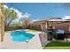 Relaxing backyard featuring a pool, spa, patio with gazebo, and well-maintained landscaping at 10381 Borah Park Cir, Las Vegas, NV 89178