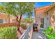 Well-maintained backyard with trees, bbq, and patio seating at 105 Lighthouse Dr # 105, Boulder City, NV 89005