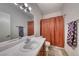 Bathroom with a single sink vanity, and a shower featuring a patterned shower curtain at 105 Lighthouse Dr # 105, Boulder City, NV 89005
