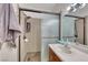 Bathroom features a tiled shower with glass door, granite counter, and undermount sink at 105 Lighthouse Dr # 105, Boulder City, NV 89005