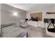Bedroom featuring a bed, dresser, TV, accent chair and carpeting at 105 Lighthouse Dr # 105, Boulder City, NV 89005