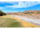 Scenic view of the community featuring a greenbelt, walkways, and desert landscape at 105 Lighthouse Dr # 105, Boulder City, NV 89005