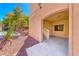 Covered entrance with stairs to an apartment unit with desert landscaping and a window at 105 Lighthouse Dr # 105, Boulder City, NV 89005