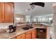 Kitchen with granite countertops, a breakfast bar and a view into the living room at 105 Lighthouse Dr # 105, Boulder City, NV 89005