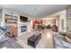 Open concept living room with tile flooring, fireplace, and kitchen bar at 105 Lighthouse Dr # 105, Boulder City, NV 89005