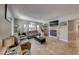 Spacious living room featuring a fireplace, large windows, and neutral paint at 105 Lighthouse Dr # 105, Boulder City, NV 89005