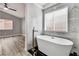 Bright primary bathroom showcases a freestanding tub, marble accents, and stylish modern fixtures at 11016 Meadow Leaf Ave, Las Vegas, NV 89144