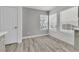 Bright dining area with neutral walls and light, wood-look flooring, ready for personalization at 11016 Meadow Leaf Ave, Las Vegas, NV 89144