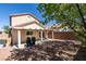 A private backyard with gravel, a covered patio, and a partial view of the home, designed for easy upkeep at 11147 Verismo St, Las Vegas, NV 89141