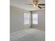 Bright bedroom with soft carpet, neutral walls and two windows offering natural light at 11147 Verismo St, Las Vegas, NV 89141