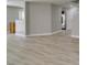 Bright, open-concept living area featuring new light wood-look flooring at 11147 Verismo St, Las Vegas, NV 89141