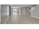Bright, open-concept living area featuring new light wood-look flooring at 11147 Verismo St, Las Vegas, NV 89141