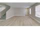 Bright, open-concept living area featuring new light wood-look flooring at 11147 Verismo St, Las Vegas, NV 89141