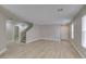 Bright, open-concept living area featuring new light wood-look flooring at 11147 Verismo St, Las Vegas, NV 89141