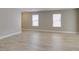 Bright, open living area with light wood-look floors and natural light at 11147 Verismo St, Las Vegas, NV 89141