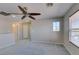 Loft featuring neutral walls, carpeted floors, with multiple windows and doors at 11147 Verismo St, Las Vegas, NV 89141