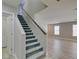 Carpeted staircase leading to the upper level, adjacent to the living area at 11147 Verismo St, Las Vegas, NV 89141