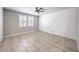 Bright bedroom with tile flooring, window shutters, and modern decor at 1197 Mission View Ct, Henderson, NV 89002