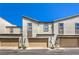 Charming townhouse exteriors featuring garages, well-maintained landscaping, and stucco siding for a modern look at 1197 Mission View Ct, Henderson, NV 89002