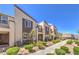 Inviting townhome exteriors with mature landscaping and charming architectural details at 1197 Mission View Ct, Henderson, NV 89002