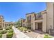 Well-maintained townhome exteriors with sidewalks, landscaping, and private front entries at 1197 Mission View Ct, Henderson, NV 89002