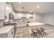 Modern kitchen featuring stainless steel appliances, white countertops, and a center island with seating for three at 1197 Mission View Ct, Henderson, NV 89002