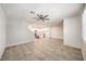 Open-concept space, showcasing tile flooring, modern lighting, and an adjacent kitchen at 1197 Mission View Ct, Henderson, NV 89002
