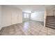 Spacious living room features tile flooring, a ceiling fan, and lots of natural light at 1197 Mission View Ct, Henderson, NV 89002