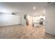 Open-concept living space with tile floors, a ceiling fan, and a modern kitchen at 1197 Mission View Ct, Henderson, NV 89002
