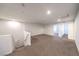 Upstairs loft area with carpet flooring, bright lighting, and multiple doorways leading to other rooms at 1197 Mission View Ct, Henderson, NV 89002