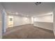 Brightly lit upstairs loft with doorways leading to other rooms; features carpet flooring and recessed lighting at 1197 Mission View Ct, Henderson, NV 89002