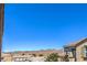 Scenic view from the balcony showcasing the neighborhood rooftops and distant mountain range at 1197 Mission View Ct, Henderson, NV 89002