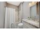 Neutral-toned bathroom features a shower-tub combination and granite countertop at 1466 Fieldbrook St, Henderson, NV 89052