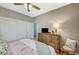 This bedroom contains plenty of storage with a dresser and wardrobe with sliding doors at 1466 Fieldbrook St, Henderson, NV 89052