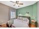 Comfortable bedroom features a ceiling fan and ample natural light from the window at 1466 Fieldbrook St, Henderson, NV 89052