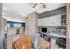 Bright dining area adjacent to kitchen, featuring stylish decor and integrated workspace at 1466 Fieldbrook St, Henderson, NV 89052
