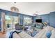 Spacious living room with large windows, modern decor, and comfortable seating at 1466 Fieldbrook St, Henderson, NV 89052