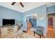 Relaxing living room with cozy seating, open doorway, and TV console at 1466 Fieldbrook St, Henderson, NV 89052
