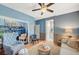 Comfortable living area featuring stylish seating, decorative bookshelf, and connecting rooms at 1466 Fieldbrook St, Henderson, NV 89052