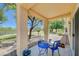 Covered patio with comfortable seating, ideal for relaxing outdoors in a landscaped yard at 1466 Fieldbrook St, Henderson, NV 89052