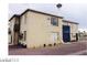 Tan two-story home featuring a second-story balcony and neutral tones at 1707 Santa Paula Dr, Las Vegas, NV 89104