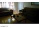 Comfortable living room with hardwood floors, dual sofas, and a central coffee table at 1707 Santa Paula Dr, Las Vegas, NV 89104