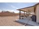 Spacious backyard featuring a covered patio, perfect for outdoor relaxation and entertainment at 171 Weeping Willow Ct, Pahrump, NV 89048