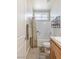 Well-lit bathroom with a shower-tub combo, tile floors, and modern finishes at 171 Weeping Willow Ct, Pahrump, NV 89048