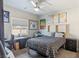 Nicely decorated bedroom with a ceiling fan, bed, and modern furniture at 171 Weeping Willow Ct, Pahrump, NV 89048