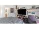 Nicely decorated bedroom with a large TV, desk, and modern furniture at 171 Weeping Willow Ct, Pahrump, NV 89048