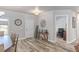 Open-concept dining area with wood-look floors, connecting to a home office at 171 Weeping Willow Ct, Pahrump, NV 89048